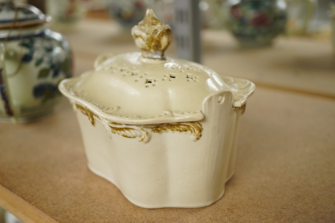 A rare Staffordshire saltglaze stoneware teapot, mid 18th century, an early 19th Wedgwood stoneware teapot and a stoneware butter tub and cover - 13cm wide (3)